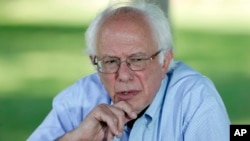 Democratic presidential candidate, Sen. Bernie Sanders, I-Vt., speaks during a television interview before a town hall meeting, Sept. 3, 2015, in Grinnell, Iowa.