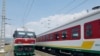 FILE - In this photo of Saturday, Sept.24, 2016, locomotives for the new Ethiopia to Djibouti electric railway system queue outside a train station in the outskirts of Addis Ababa. One of Africa's best-performing economies on Wednesday launched its latest massive infrastructure project, a railway linking the landlocked country with a major port on the Gulf of Aden. But it came just days after dozens were killed in anti-government protests in the region the railway runs through. 