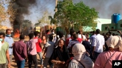 Anti-government protesters rally in Khartoum, Sudan, Sunday, Jan. 13, 2019.