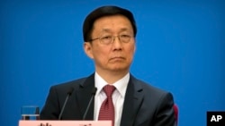 Vice Premier Han Zheng attends a press conference after the closing session of China's National People's Congress (NPC) at the Great Hall of the People in Beijing, Tuesday, March 20, 2018. 