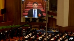 Chinese President Xi Jinping is displayed on a large screen during the opening session of the annual National People's Congress in Beijing's Great Hall of the People, March 5, 2016. Xi issued a strong warning to Taiwan and its incoming, independence-leaning government.
