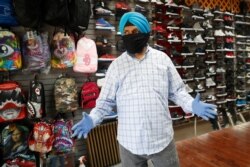 Multani Singh, owner of J&amp;M sneakers, talks about keeping his business alive during nearly three months of shutdown, June 8, 2020, in the Sunset Park neighborhood of the Brooklyn borough of New York.