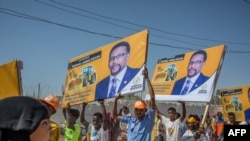 Supporters hold banners of candidates during a rally of the opposition Waddani Party for Somaliland’s elections in Hargeisa, the capital of the self-declared republic of Somaliland in northern Somalia, May 25, 2021.