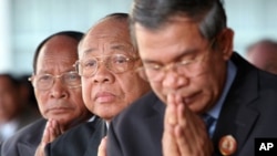 Chea Sim, center, president of the ruling Cambodian People's Party, Heng Samring, rear left, the party honorary president, Hun Sen, foreground, the party's vice president and the prime minister of the Cambodian government, file photo. 