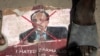 Demonstrators from Somali anti-government opposition groups stand on photographs of the president in the Fagah area of Mogadishu, Somalia, April 25, 2021.