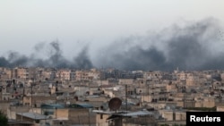 Smoke rises after airstrikes on the rebel-held al-Sakhour neighborhood of Aleppo, Syria, April 29, 2016. 