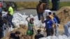 Floods Force Evacuations Along US Waterways
