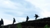 Des soldats avancent au nord de Goma, le 5 novembre 2013. 