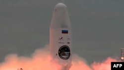 FILE - In this handout from the Russian Space Agency Roscosmos on August 11, 2023, a Soyuz 2.1b rocket with the Luna-25 lander blasts off at the Vostochny cosmodrome in the Amur region. (Russian Space Agency Roscosmos/AFP) 