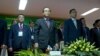 Election reform working group co-chairs Bin Chhen (center) of the Cambodian People's Party (CPP) and Kuoy Bunroeun (right) of the Cambodia National Rescue Party (CNRP) stand up at the opening of a national workshop on two new election draft laws on Monday, March 9, 2015 at the National Assembly before the discussion. (Neou Vannarin/VOA Khmer) 