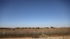 FILE - Israeli soldiers patrol the cease-fire line between Israel and Syria, as seen from the Israeli-occupied Golan Heights, July 26, 2018.