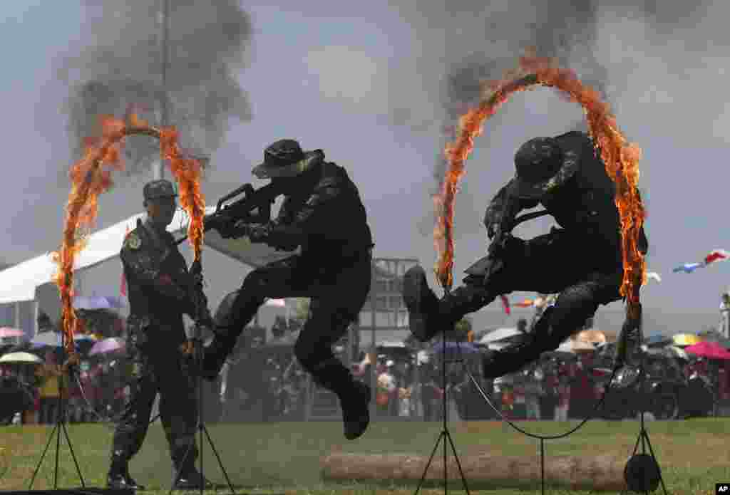 Chinese People's Liberation Army (PLA) personnel demonstrate during the opening day of Stonecutter Island Navy Base to mark the 18th anniversary of the Hong Kong handover to China, Hong Kong, July 1, 2015.