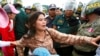 Tep Vanny of Boeung Kak lake is blocked by riot police officers during a protest rally near the prime minister's residence in Phnom Penh, Cambodia, file photo. 