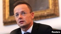 FILE - Hungarian Foreign Minister Peter Szijjarto attends an interview with Reuters in Budapest, Hungary, Sept. 12, 2017. 