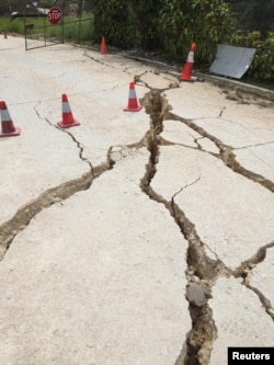 Cracks left by a powerful 7.5 magnitude earthquake are seen in Hela, Papua New Guinea, Feb. 26, 2018, in this picture obtained from social media.