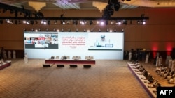 FILE - Qatar's Minister of Foreign Affairs Sheikh Mohamad Bin Abdel Rahman Al-Thani delivers a speech during the opening session of the peace talks between the Afghan government and the Taliban in the Qatari, capital Doha, Sept. 20, 2020.