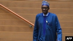 FILE - Nigeria's President Muhammadu Buhari walks after speaking at the 30th annual African Union summit in Addis Ababa, Ethiopia, Jan. 28, 2018.