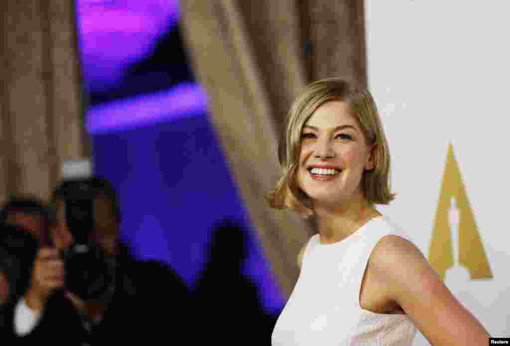 Rosamund Pike, Best Actress nominee for her role in the film "Gone Girl," arrives at the 87th Academy Awards nominees luncheon in Beverly Hills, California, Feb. 2, 2015.