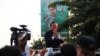 Kem Sokha vice president of the Cambodia National Rescue Party and First Vice President of the National Assembly greets his supporters from his car after leaving Phnom Penh Municipal Court on Wednesday, April 8th, 2015. 
