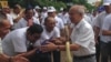 FILE: Prince Norodom Ranariddh, president of FUNCINPEC, is greeted by his supporters during an election campaign in Kampong Cham province on May 20, 2017. (Courtesy photo from a local journalist) 