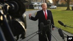 FILE - President Donald Trump speaks to reporters on the South Lawn of the White House in Washington, Dec. 4, 2017. 