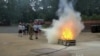 Girls learning firefighting techniques