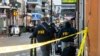 FBI investigators arrive at the scene where the white Ford F-150 pickup truck that crashed into a work lift after allegedly driving into a crowd of New Year's revelers in the French Quarter of New Orleans, Louisiana, on January 1, 2025.