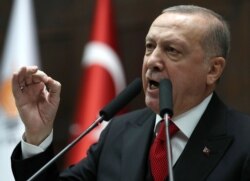 President of Turkey and leader of Justice and Development (AK) Party Recep Tayyip Erdogan speaks at the party's group meeting at Grand National Assembly of Turkey in Ankara, Feb.12, 2020.