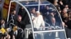 Pope Benedict XVI greets pilgrims in St. Peter's Square at the Vatican in his final appearance, Feb. 27, 2013.