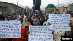 FILE - Protesters march who are against Burundi President Pierre Nkurunziza and his bid for a third term, in Bujumbura, Burundi, June 4, 2015.