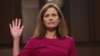 Calon hakim agung Amy Coney Barrett disumpah sebelum dimulainya Sidang Konfirmasi di Senat AS hari Senin (12/10). 