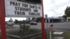 Businesses throughout the town of Santa Fe, Texas, post signs in support of the survivors and the loved ones of those killed in the high school shooting May 18, 2018.