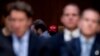 FILE - An audience member wears a pro-Trump hat as Department of Justice Inspector General Michael Horowitz testifies at a Senate Judiciary Committee hearing on the IG's report on alleged FISA abuses, Dec. 11, 2019, on Capitol Hill in Washington.
