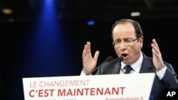 French Socialist Party candidate for the 2012 presidential elections Francois Hollande delivers his speech during a campaign meeting in Lille, northern France, April 17, 2012.
