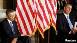 U.S. President Barack Obama, with GOP House Speaker John Boehner, at a ceremony in the U.S. Capitol in Washington, February 27, 2013. 