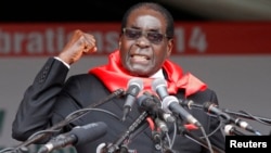 Zimbabwe President Robert Mugabe addresses supporters during celebrations to mark his 90th birthday in Marondera about 80km ( 50 miles) east of the capital Harare, Feb. 23, 2014. Mugabe turned 90 on February 21. 