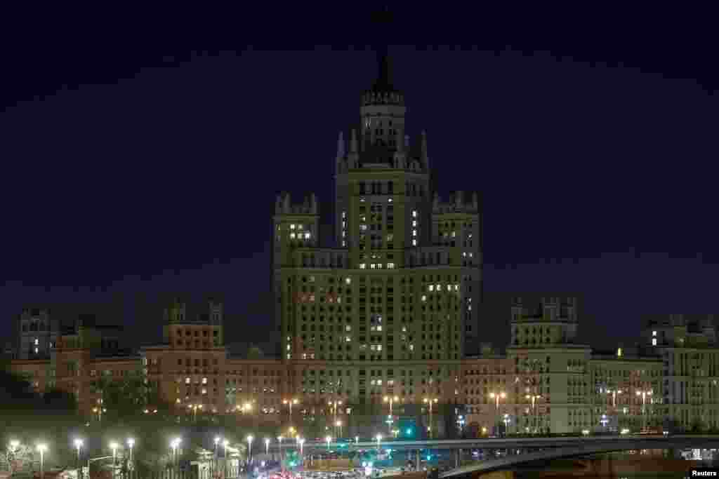 Stalin's era skyscraper is seen after the lights are switched off for Earth Hour in Moscow, March 30, 2019.