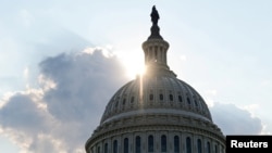 FILE - The dome of the U.S. Capitol Building is seen as the sun sets on Capitol Hill in Washington, July 26, 2019.