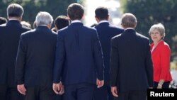 FILE - Britain's Prime Minister Theresa May arrives for a family photo during the European Union leaders' informal summit in Salzburg, Austria, Sept. 20, 2018.