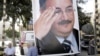 A memorial poster of Brig. Gen. Wissam al-Hassan, who was assassinated Friday, hangs near the spot Friday's car bomb attack that killed Al-Hassan, in the Achrafiye district of Beirut, Lebanon, October 23, 2012.