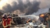 Firefighters spray water at a fire after an explosion was heard in Beirut, Lebanon Aug. 4, 2020. 