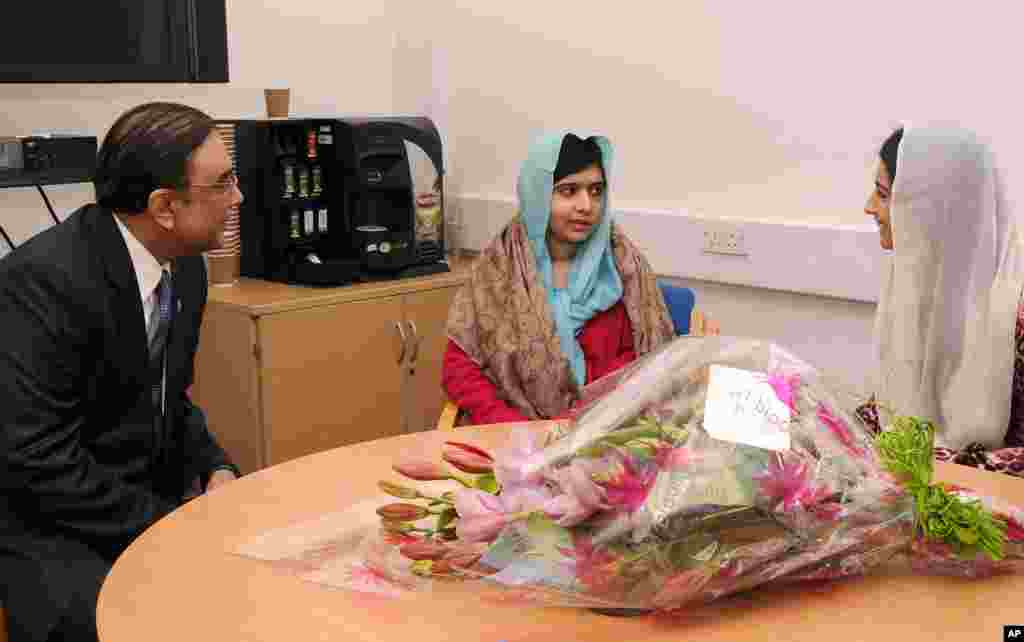 This photo provided by the Queen Elizabeth Hospital Birmingham shows Pakistan's President Asif Ali Zardari, and his daughter Asifa Bhutto, right, meeting with Malala Yousafzai at the hospital, December 8, 2012.