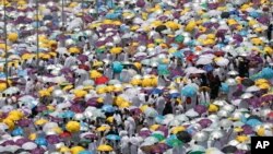 Hundreds of thousands of Muslim pilgrims listen to a sermon outside Namira Mosque in Arafat during the annual hajj pilgrimage, near the holy city of Mecca, Saudi Arabia, Saturday, Aug. 10, 2019.