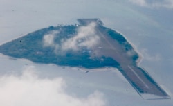FILE - Philippine-claimed Thitu island, part of the Spratlys group of islands, is shown April 21, 2017.