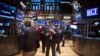 Traders work on the floor of the New York Stock Exchange in New York, March 18, 2014.