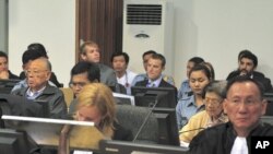 Former Khmer Rouge foreign minister Ieng Sary (2nd row from front, L) and former social affairs minister Ieng Thirith (2nd row from front, 2nd R) sit at the Extraordinary Chambers in the Courts of Cambodia (ECCC) on the outskirts of Phnom Penh June 27, 2011.