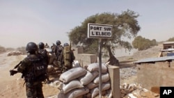 Cameroon soldiers stand guard at a lookout post as they take part in operations against the Islamic extremists group Boko Haram near the village of Fotokol, Cameroon. 