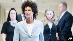 Andrea Constand walks to the courtroom during Bill Cosby's sexual assault trial at the Montgomery County Courthouse in Norristown, Pa., June 6, 2017.