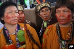 A group of indigenous wait for the arrival of Pope Francis in Puerto Maldonado, Madre de Dios province, Peru, Jan. 19, 2018.