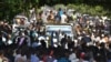 Sudanese protesters hold a sit-in outside the presidential palace in Khartoum, demanding a return to military rule, on October 21, 2021.